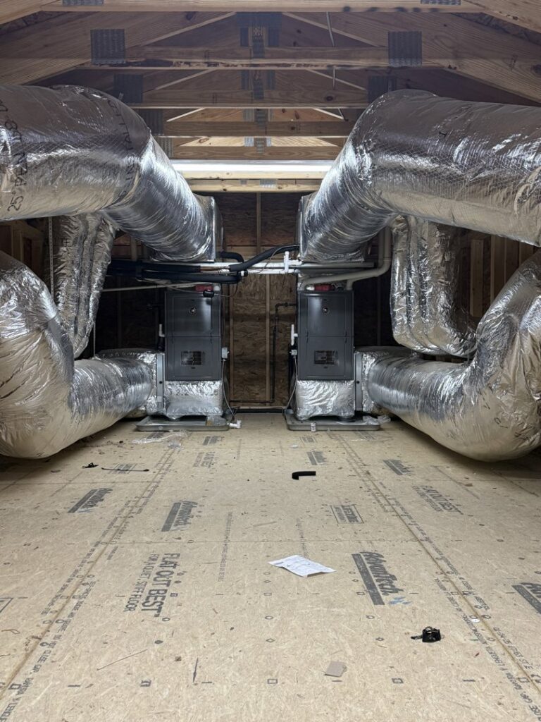 Dual HVAC furnace and air handler system with extensive ductwork installed by Brad Emberton's HVAC in Owensboro, KY.