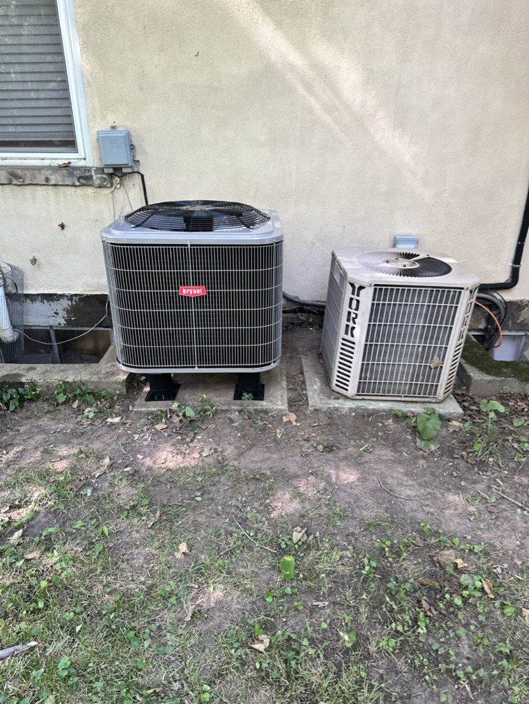 Two indoor HVAC furnace units with ductwork, installed or serviced by Carpenter Mechanical in Columbus, OH.
