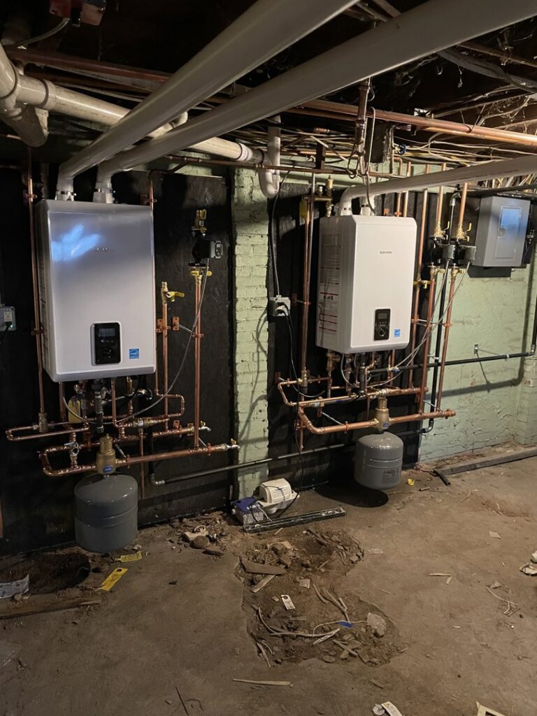 Dual Navien tankless boilers and heating system installation by Excel Mechanical and Construction LLC in Brunswick, ME