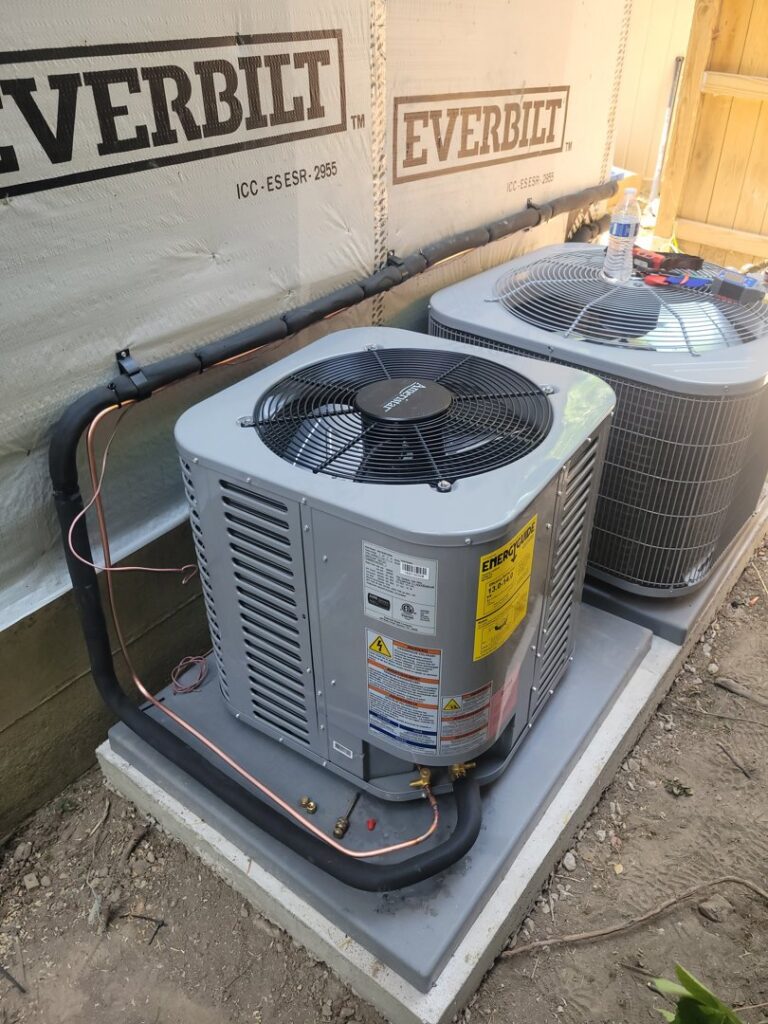 Two outdoor AC units newly installed with copper lines by Brothers Heating & Cooling Inc. in Chicago, IL.