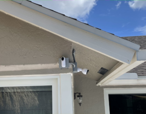 Installation of two outdoor security cameras with electrical conduit and junction boxes by One Installation Inc. in Davie, FL