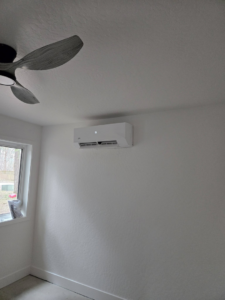 A modern ductless mini-split HVAC system installed on a wall by Maddog Contracting LLC in Post Falls, ID.