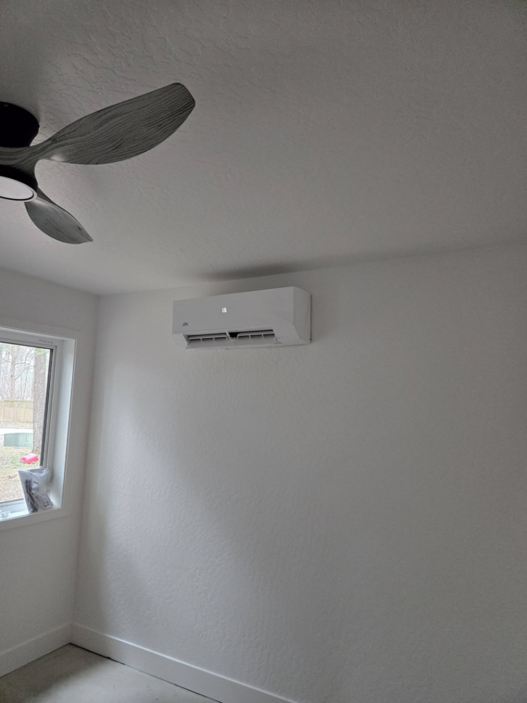 A modern ductless mini-split HVAC system installed on a wall by Maddog Contracting LLC in Post Falls, ID.