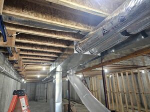 Extensive ductwork installation in an unfinished basement by Aces of Air Inc. in Georgetown, KY.