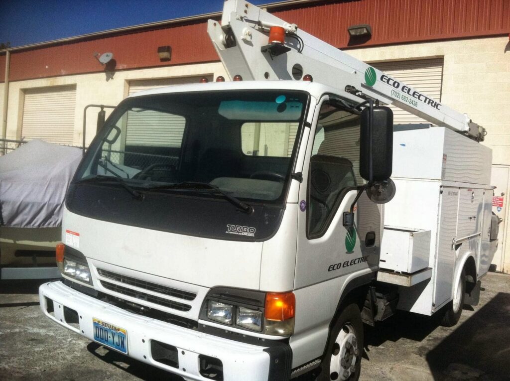 An Eco Electric service truck with a boom lift, ready for electrical work in Las Vegas, NV.