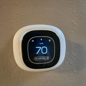 An Ecobee smart thermostat installed on a wall by Conrad Heating and Cooling in Beaverton, OR.