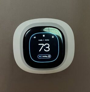 A modern Ecobee smart thermostat displaying 73 degrees, installed by JK Mechanical in Willow Street, PA.