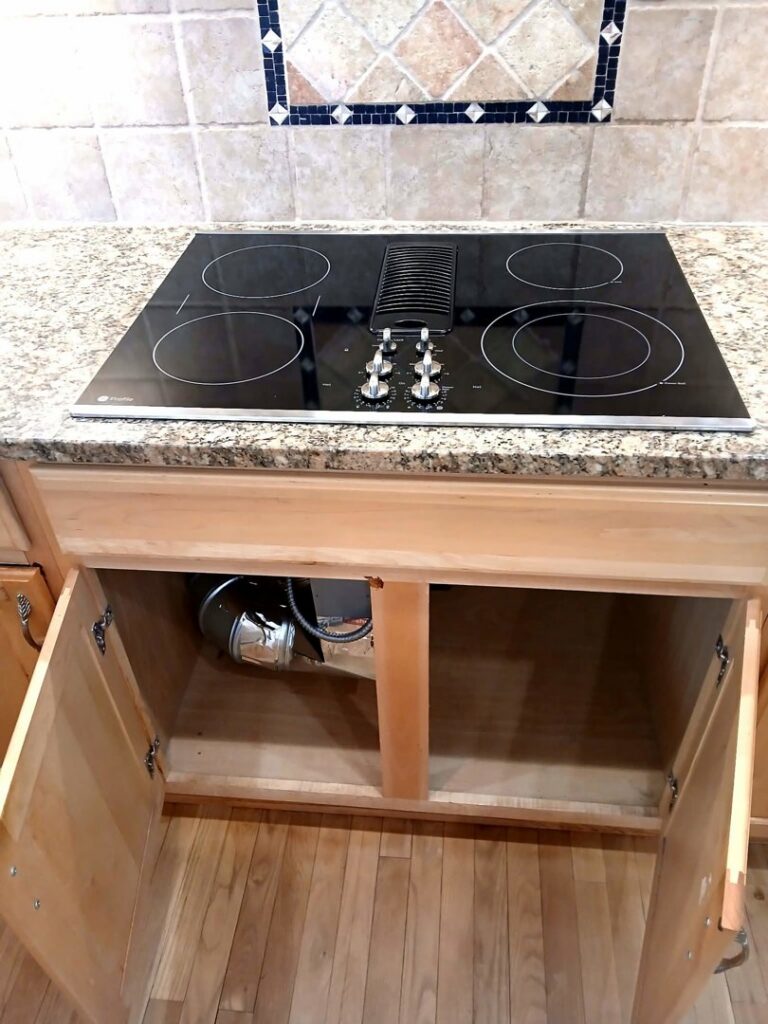 An electric cooktop and its ventilation system installed in a kitchen by True Vine Electric in Raleigh, NC