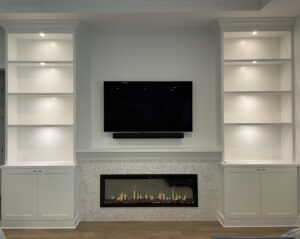 Custom electric fireplace and built-in shelf lighting installed by T.E.C Electrical Contracting, LLC in Jacksonville, FL