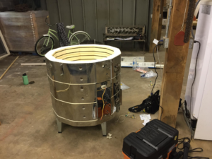 An electric kiln being assembled and wired for service by Electric Rivers in Athens, GA