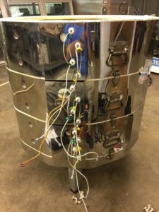 An electric kiln with exposed wiring during installation or repair by Electric Rivers in Athens, GA