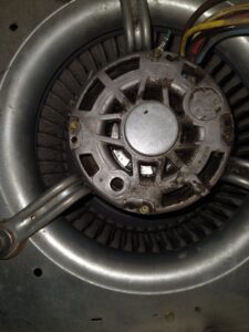 An electric motor with fan/blower components, indicating repair services by Caddell Electric Co Inc in Dallas, TX.