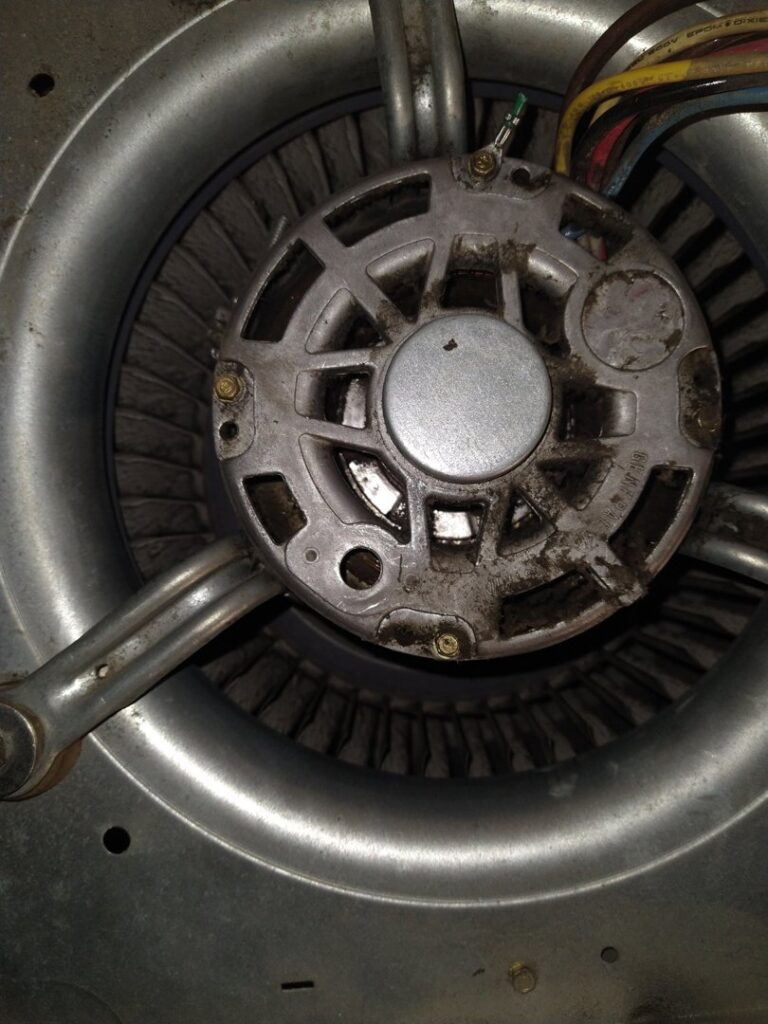 An electric motor with fan/blower components, indicating repair services by Caddell Electric Co Inc in Dallas, TX.