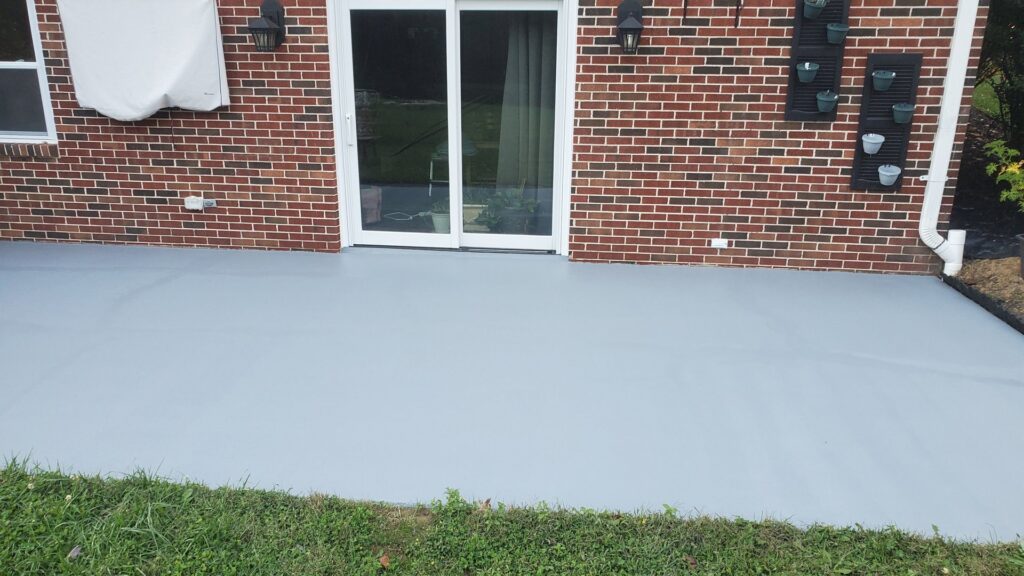 An electric vehicle charging station installed on an exterior stone wall by Gurley Electric LLC in Churchville, MD