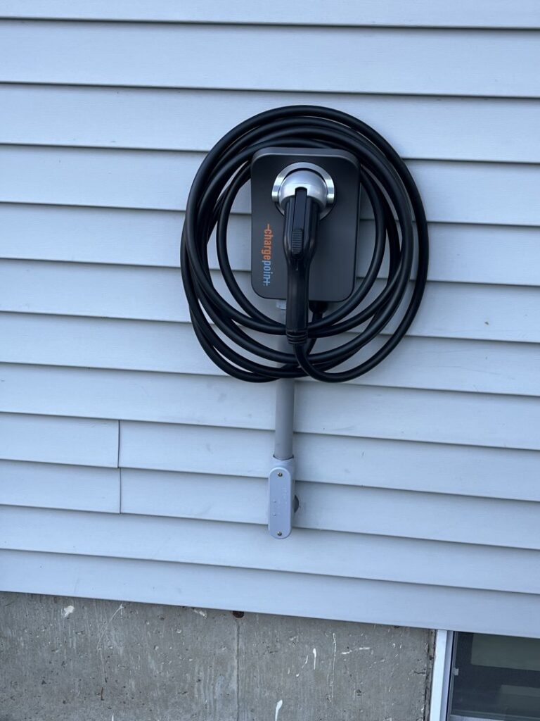 An electric vehicle (EV) charger professionally installed on a home by Russell Electric LLC in Saint Clair, MI