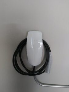 An electric vehicle charger installed on a wall, a service provided by Tesla Alarm and Electrical in Plano, TX
