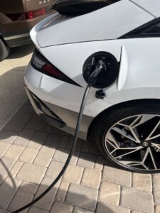 An electric vehicle charging at a residential charging station installed by HomeRun Electric LLC in Arlington, TX