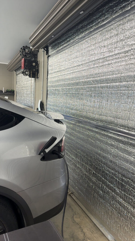 An electric vehicle charging in a garage, a service provided by Geter Electrical Services LLC in Fountain Inn, SC.
