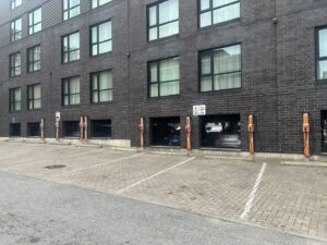 Multiple electric vehicle charging stations installed outside a building by Cummings Electric in South Burlington, VT