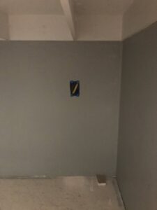 An electrical box cutout with wires during rough-in work by Christensen Electric in Galveston, TX.