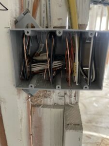 An open electrical box with wires during rough-in installation by G5 Electric LLC in Phoenix, AZ