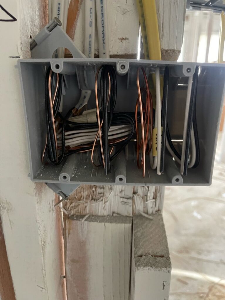 An open electrical box with wires during rough-in installation by G5 Electric LLC in Phoenix, AZ