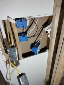 Electrical boxes and wiring installed in a wall opening during an electrical rough-in by Devin Parker Electric in Knoxville, TN