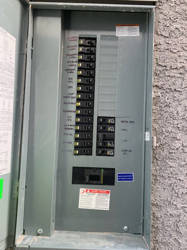 An open electrical breaker panel showing labeled circuits, serviced by Canyon Electric Company, Inc. in North Las Vegas, NV