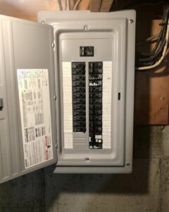 An open electrical breaker panel showing circuit breakers, installed by Bacon Electric, LLC in Concord, NH.