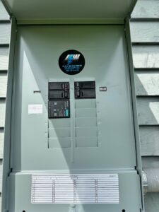 A newly installed electrical breaker panel with the business logo by LiveWire Electrical Services, LLC. in Houma, LA.