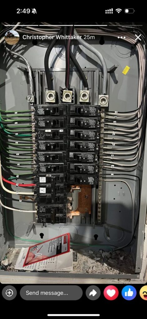 An open electrical breaker panel showing wiring and circuit breakers installed by E & E Electric in Post Falls, ID.