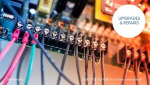 Close-up of an electrical circuit board with wires, showing upgrades and repairs by Jolt Electric in Salem, MA