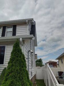 Electrical conduit expertly installed on the exterior of a residential building by Colman Electric in Cambridge, MA.