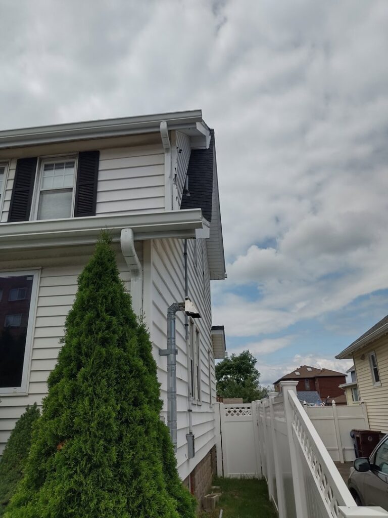 Electrical conduit expertly installed on the exterior of a residential building by Colman Electric in Cambridge, MA.