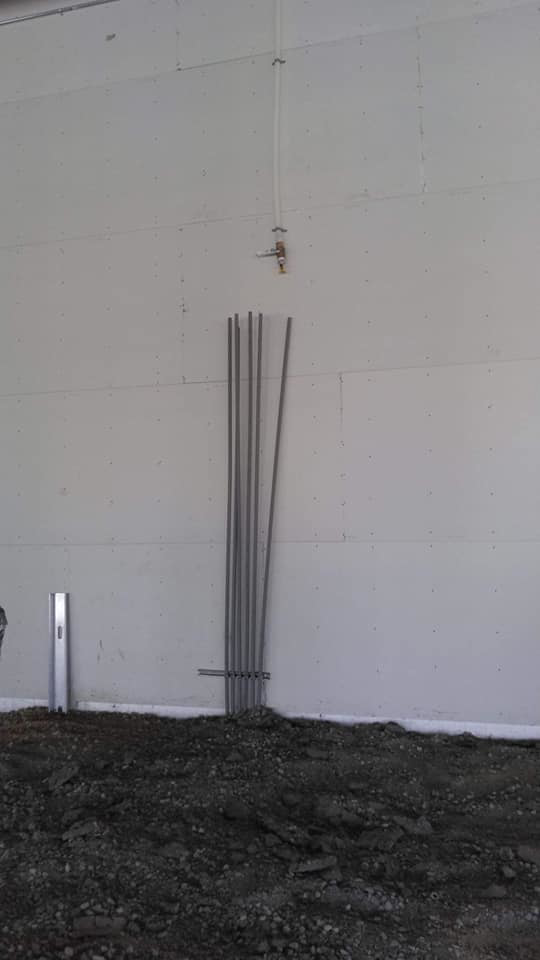 Electrical conduit installation on a wall by Grace Electric Co. in Des Moines, IA.