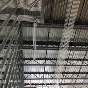 Electrical conduit installation on the ceiling and walls of a commercial building by Tri-Area Electrical Construction in Cape Coral, FL.