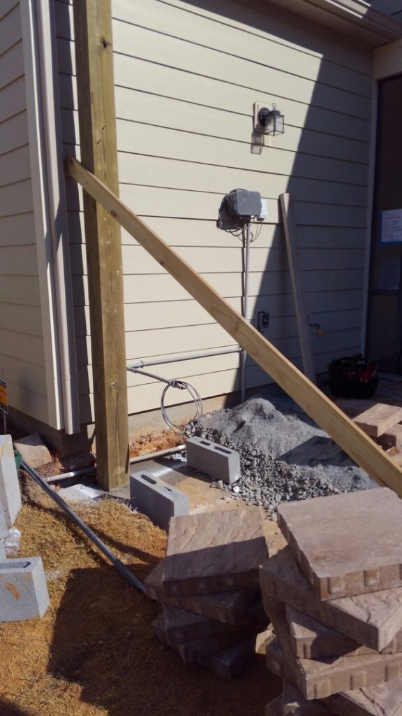 Electrical conduit and junction boxes installed on a concrete block wall by Starnes Electric LLC in Rock Hill, SC.