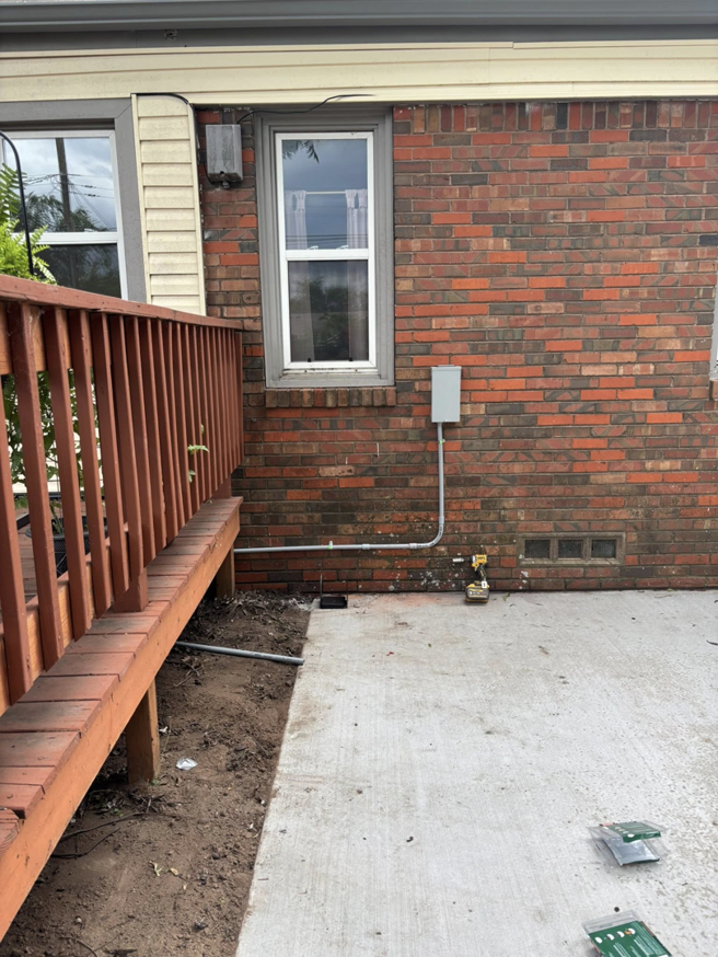Electrical conduit and meter box installation on a brick house by Top notch electric llc in Clearwater, FL