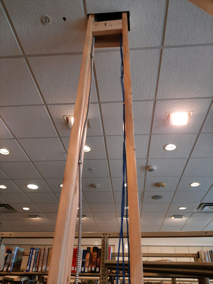 Electrical conduit and wiring being installed in a ceiling by Ostberg Electrical Solutions in Idaho Falls, ID.