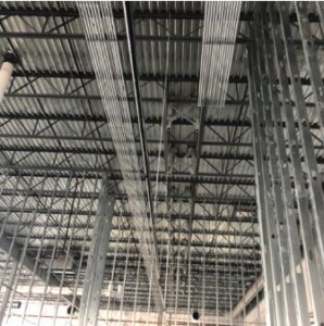 Electrical conduit and wiring installation on the ceiling of a commercial building by Tri-Area Electrical Construction in Cape Coral, FL.