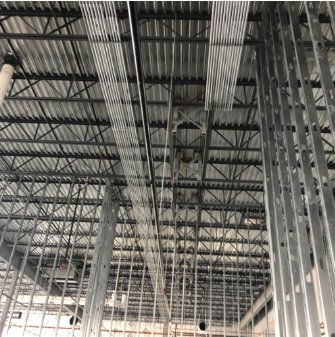 Electrical conduit and wiring installation on the ceiling of a commercial building by Tri-Area Electrical Construction in Cape Coral, FL.