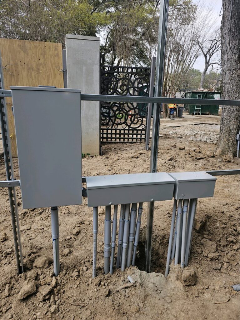 Underground electrical conduits and boxes installed for a new project by Powered By H in Houston, TX.