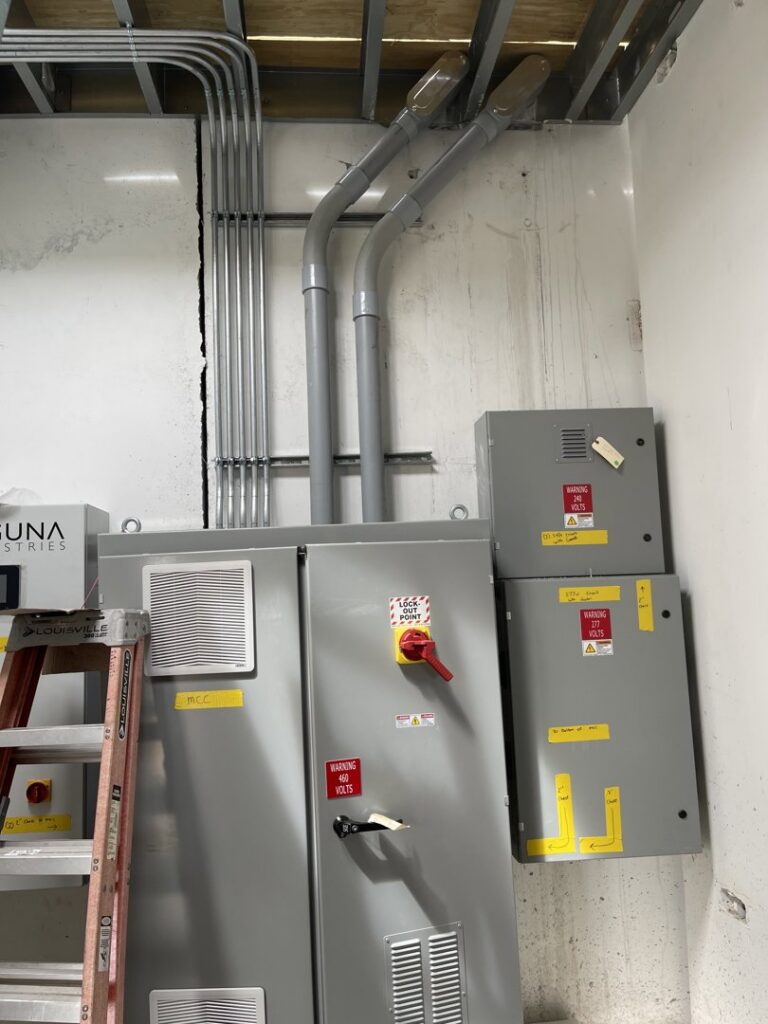 Newly installed electrical conduits and panels on a wall, showcasing electrical work by Jesse's Electric in Laredo, TX.