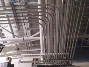 Electrical conduits professionally installed on a ceiling, showcasing commercial wiring work by Crosby Electric, LLC in Brattleboro, VT.