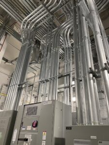 Electrical conduits and panels installed in an industrial setting by IBEW Local 24 Membership Development in Baltimore, MD.