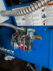 Electrical control box with push buttons and internal wiring, installed by Apex Electrical Solutions in Minot, ND.