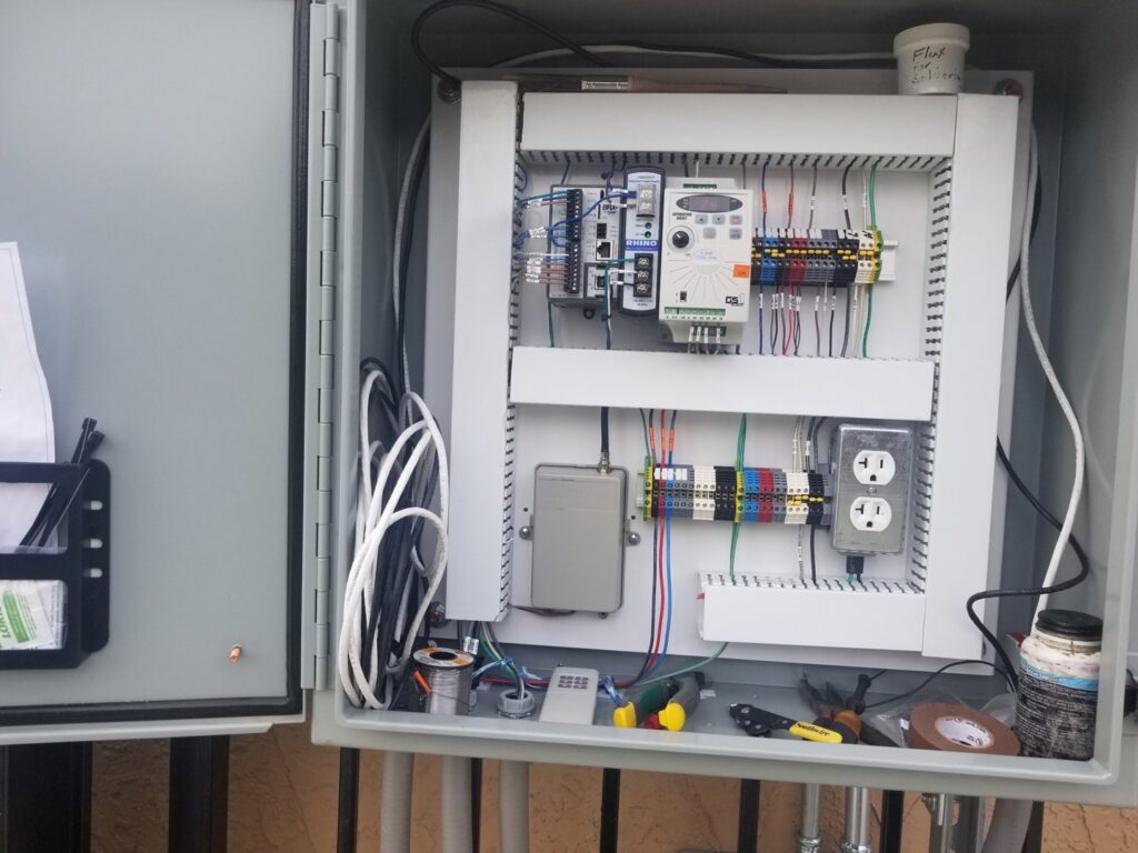 Close-up of an electrical control panel with intricate wiring and components installed by J&L Electric Inc. in San Antonio, TX