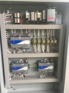 Detailed view of an electrical control panel with complex wiring and components, serviced by Master Controls in Cheyenne, WY