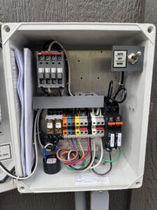 Detailed view of an electrical control panel with intricate wiring, serviced by McCurley Electric in Little Rock, AR.