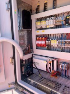 An open electrical control panel showing circuit breakers and wiring by Sparrow Electric, LLC in Denver, CO.